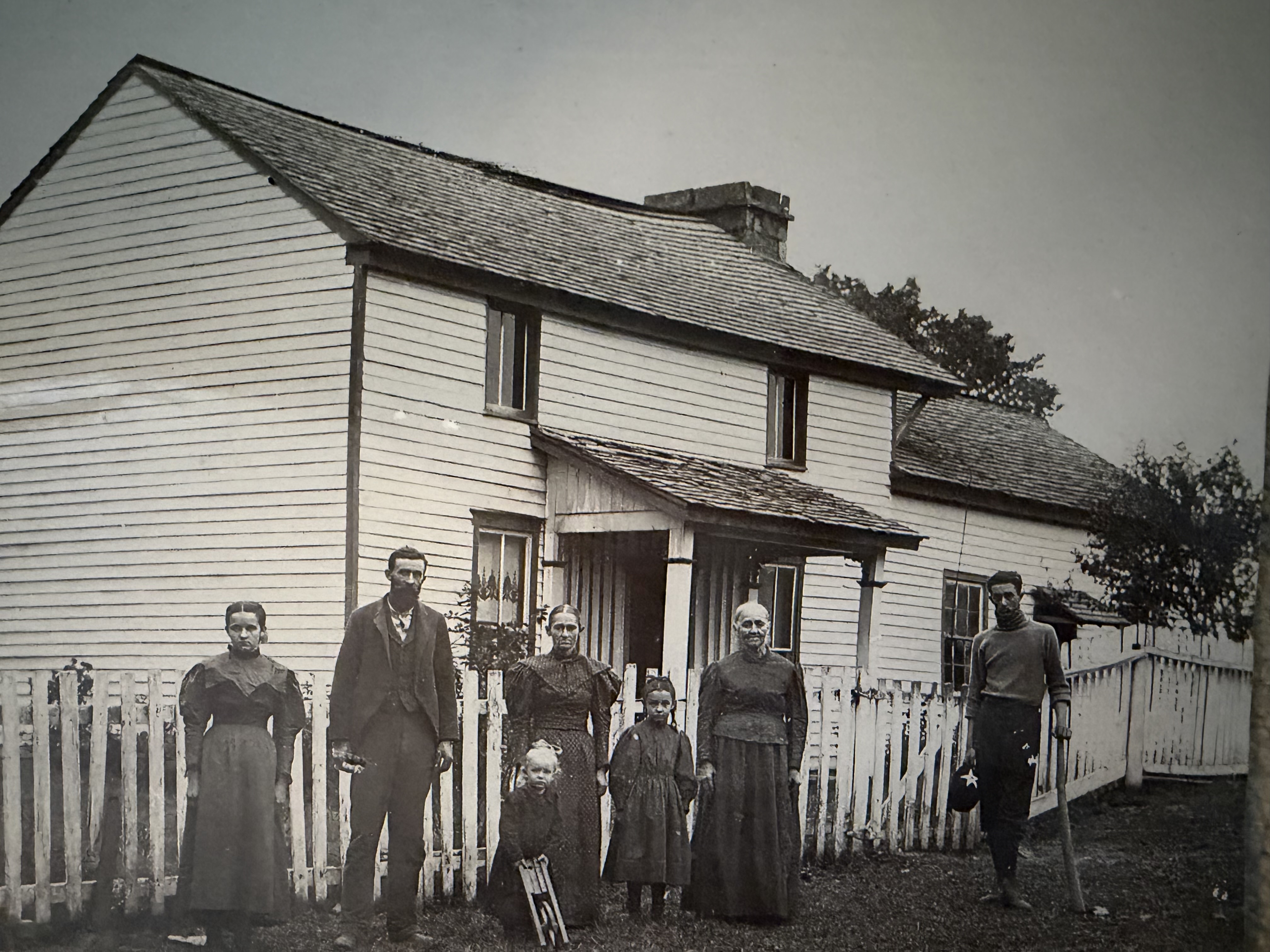The Trimble family standing in front of the farmhouse, circa 1893